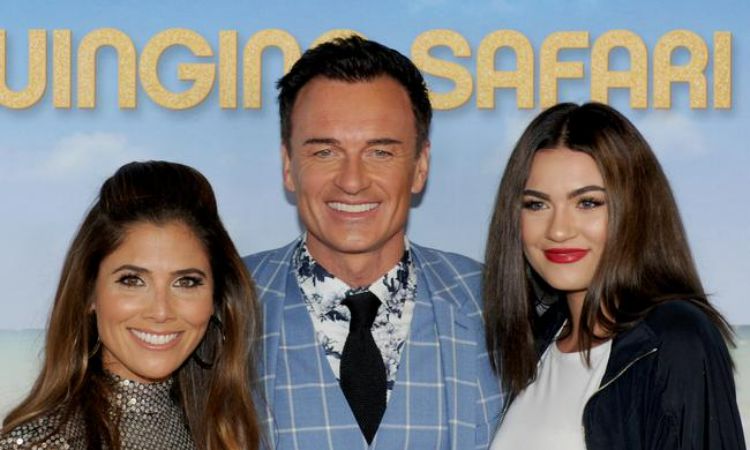 Kelly Paniagua (left) with her husband, Julian McMahon, and Stepdaughter, Madison.